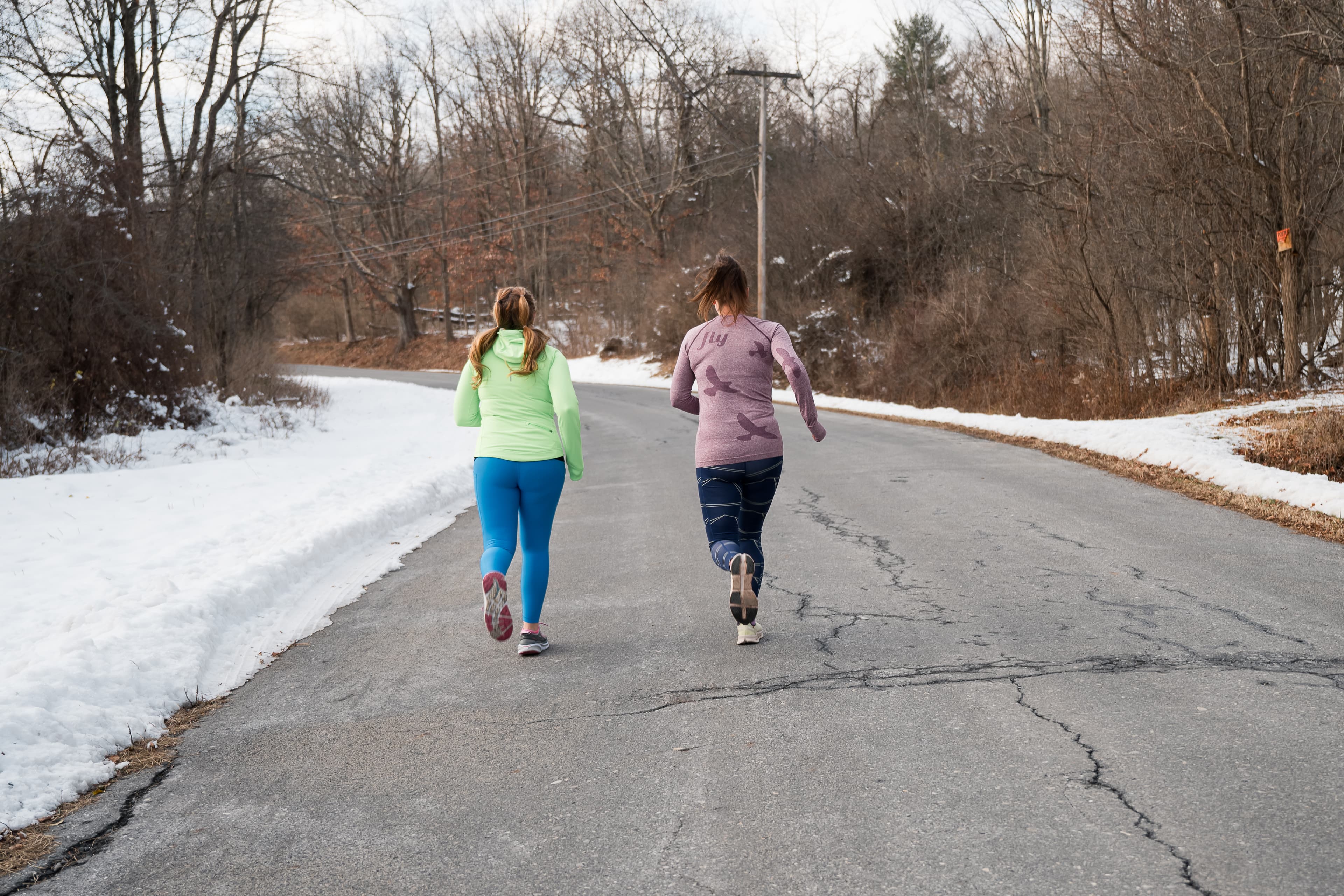 Two runners on a winter road in New York's Capital Region