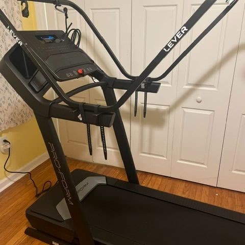 The Lever body-weight support frame attached to a home treadmill